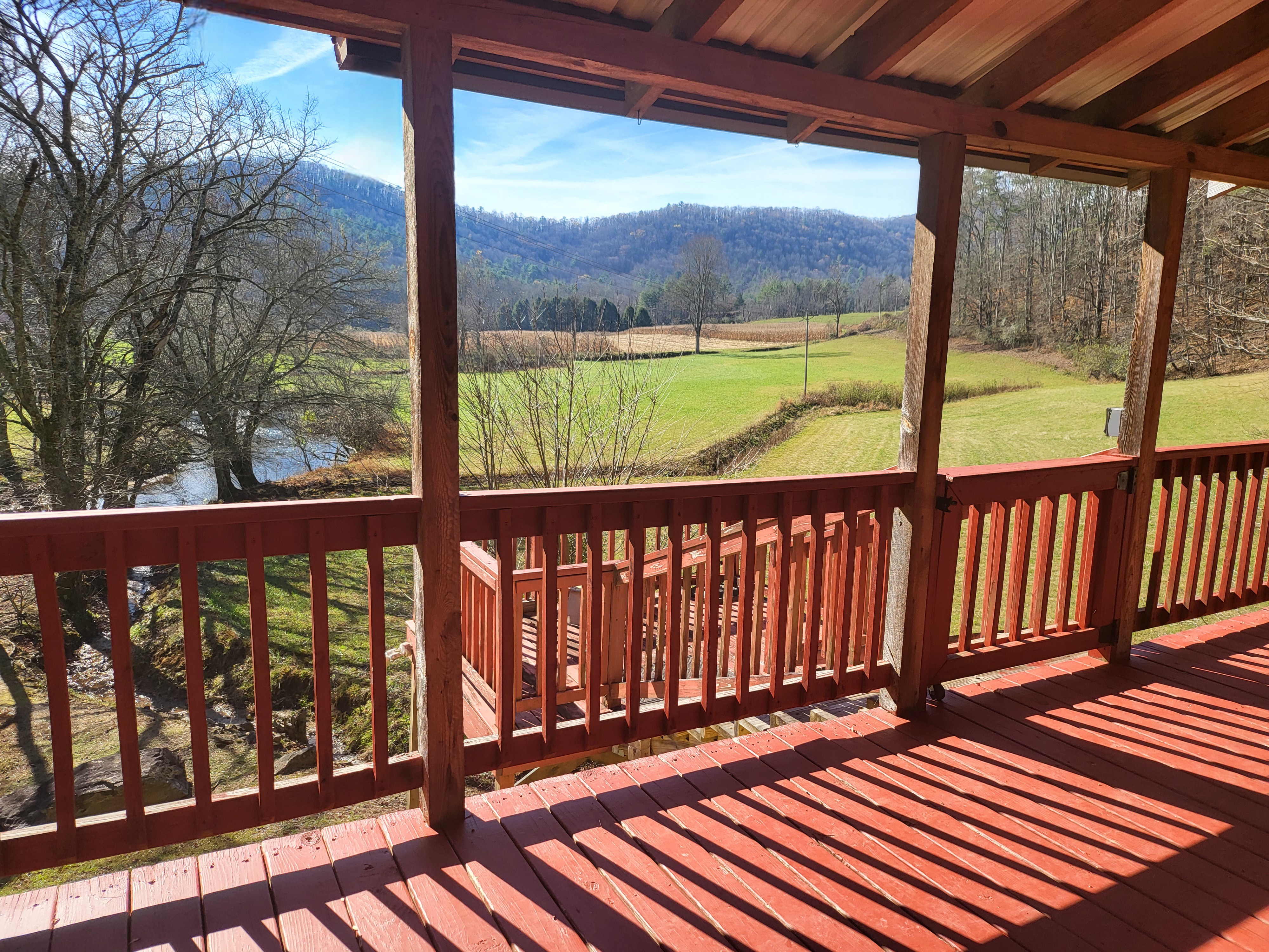Mountain and pasture views from the Headwaters deck